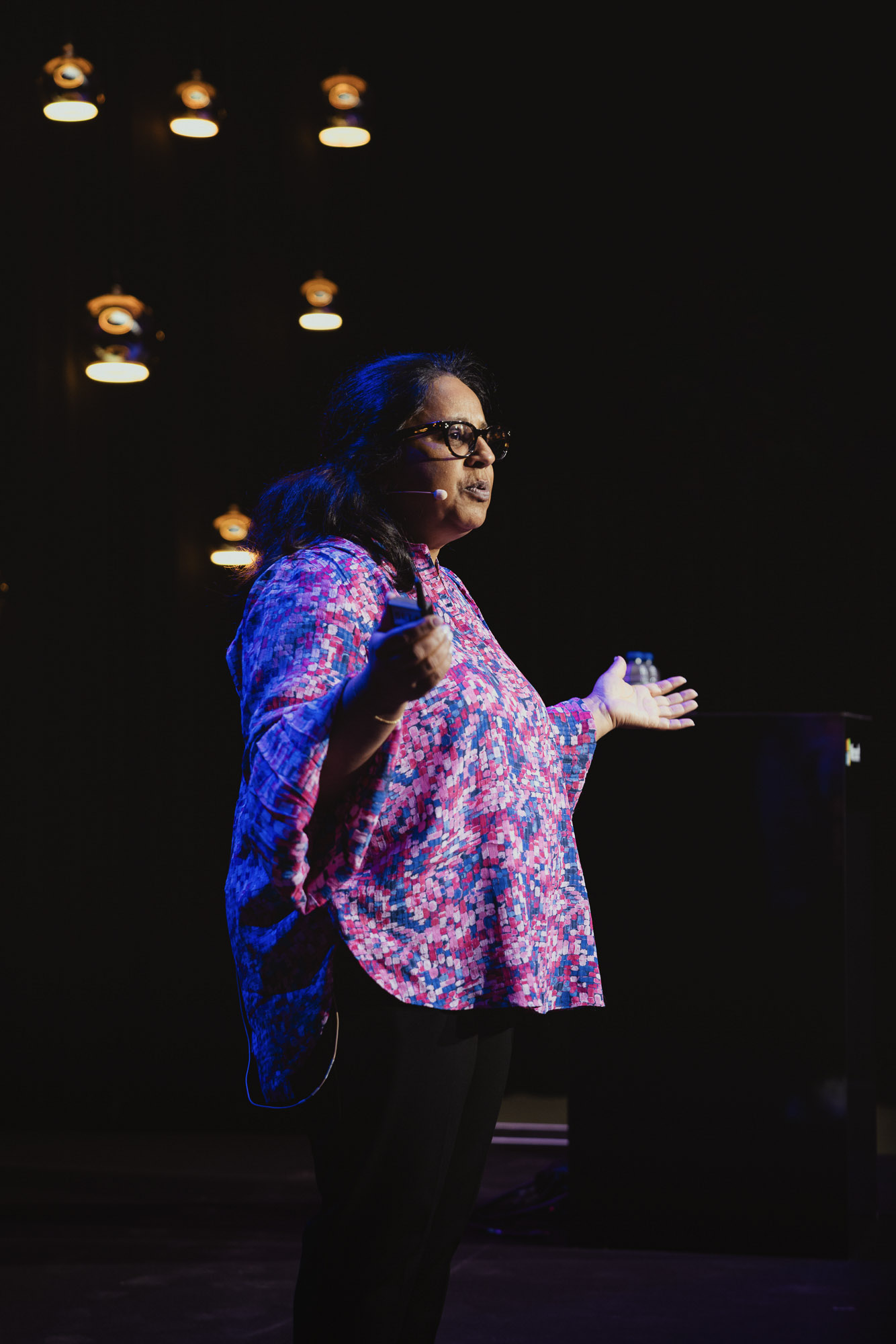 woman speaking on stage